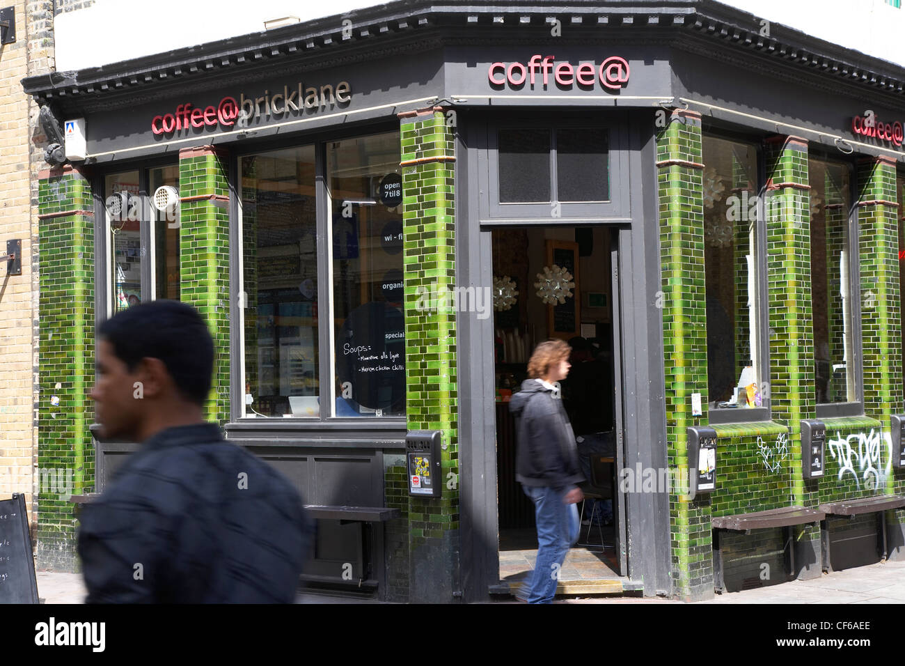 Exterior view of a customer outside a coffee house in Brick Lane. Stock Photo