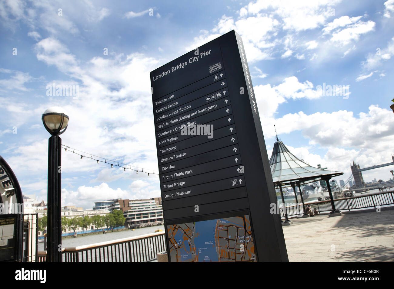 A sign with directions on the Thames pathway at London Bridge Stock Photo Alamy
