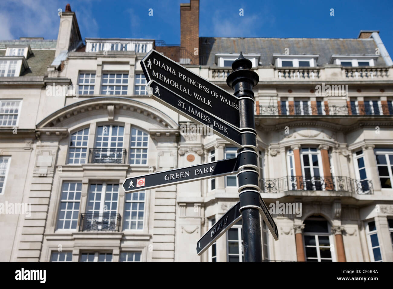 Buildings behind a directional sign in the Pall Mall area of London. Stock Photo