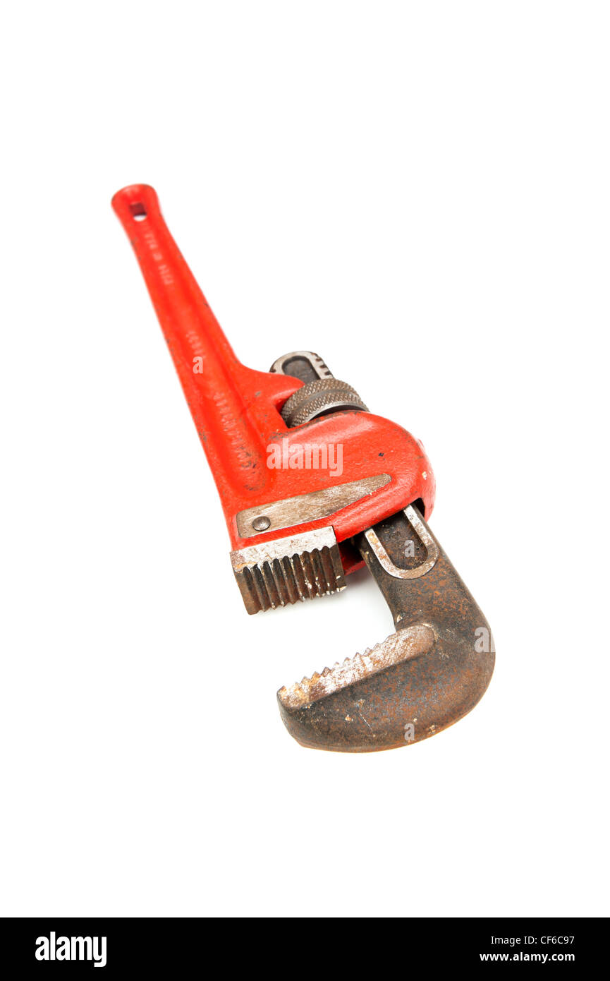 An old plumber's pipe wrench on white. This is also commonly called a monkey wrench. Stock Photo