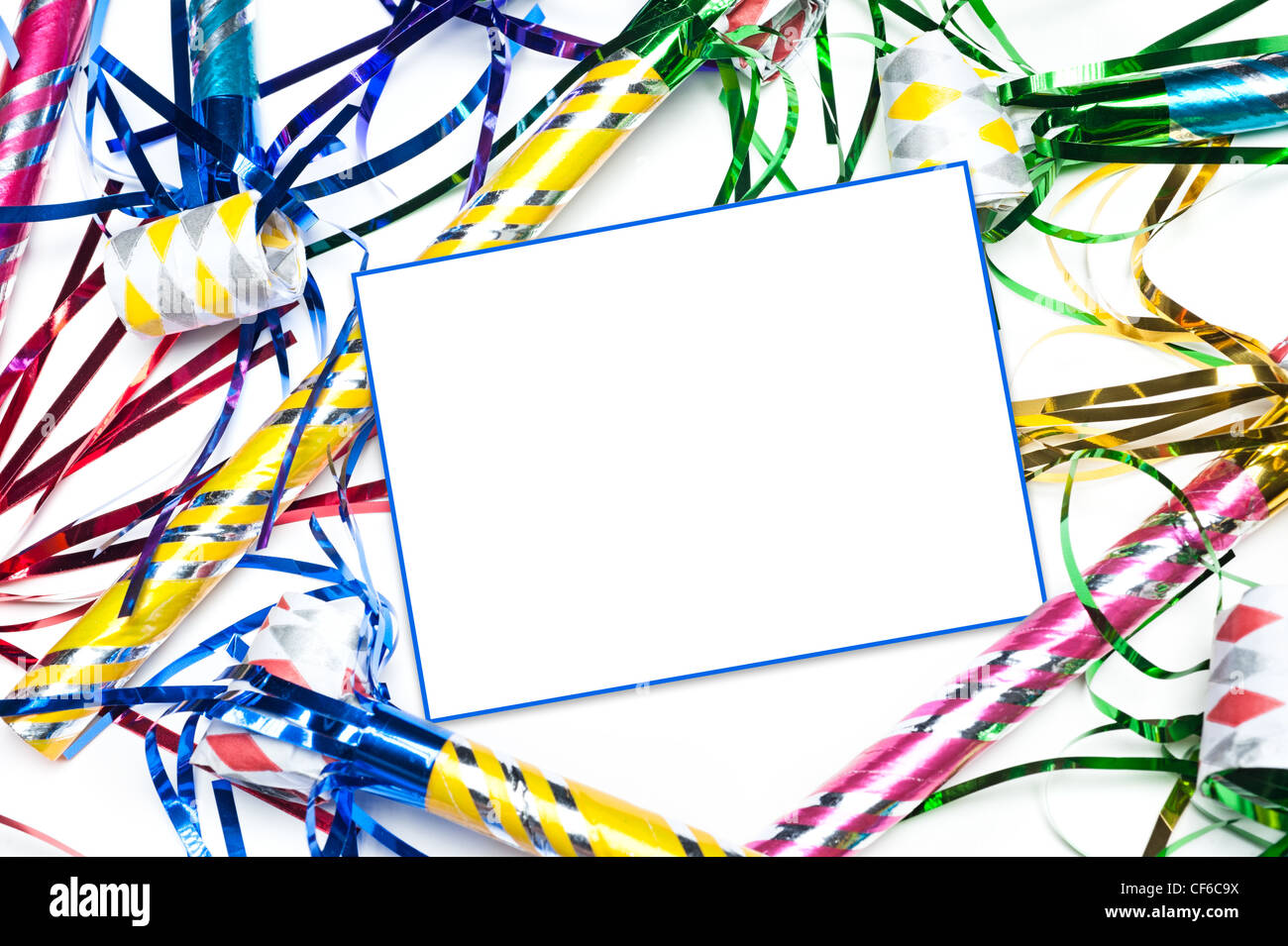 A blank party invitation with party blow horns and streamers. Card is blank for placement of copy. Stock Photo