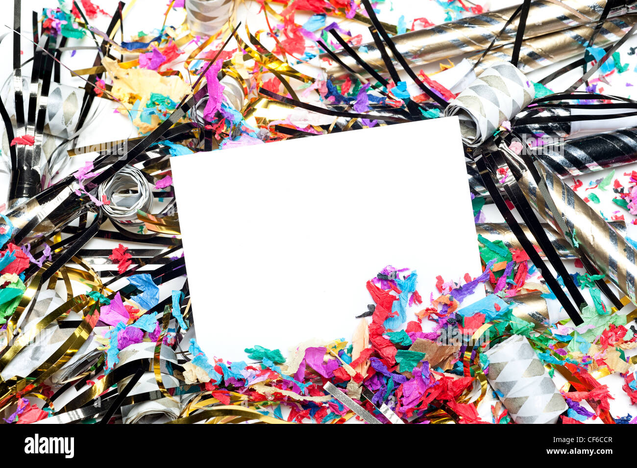 A blank party invitation with party blow horns and streamers. Card is blank for placement of copy. Stock Photo