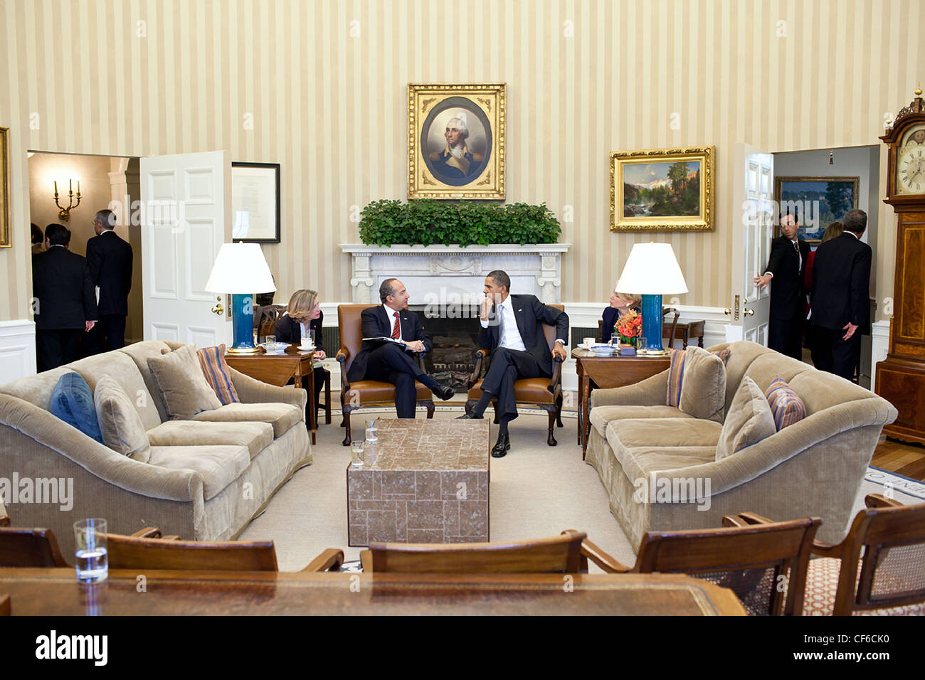 President Barack Obama talks with President Felipe Calderón of Mexico in the Oval Office following an expanded bilateral meeting March 3, 2011 in Washington, DC. Stock Photo