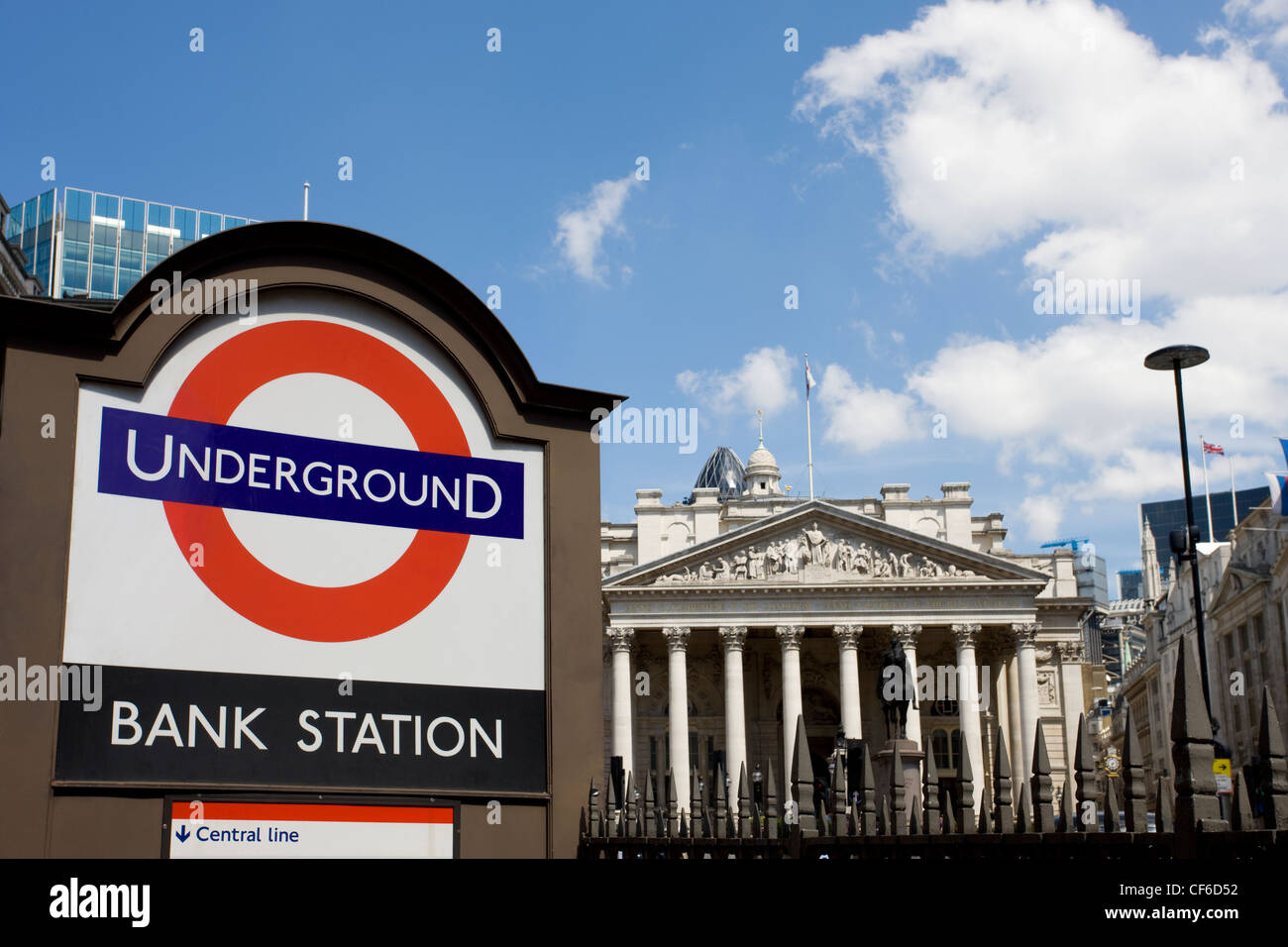 Bank Underground station sign with the Royal Exchange in the background. The Royal Exchange, a Grade l listed building, was crea Stock Photo