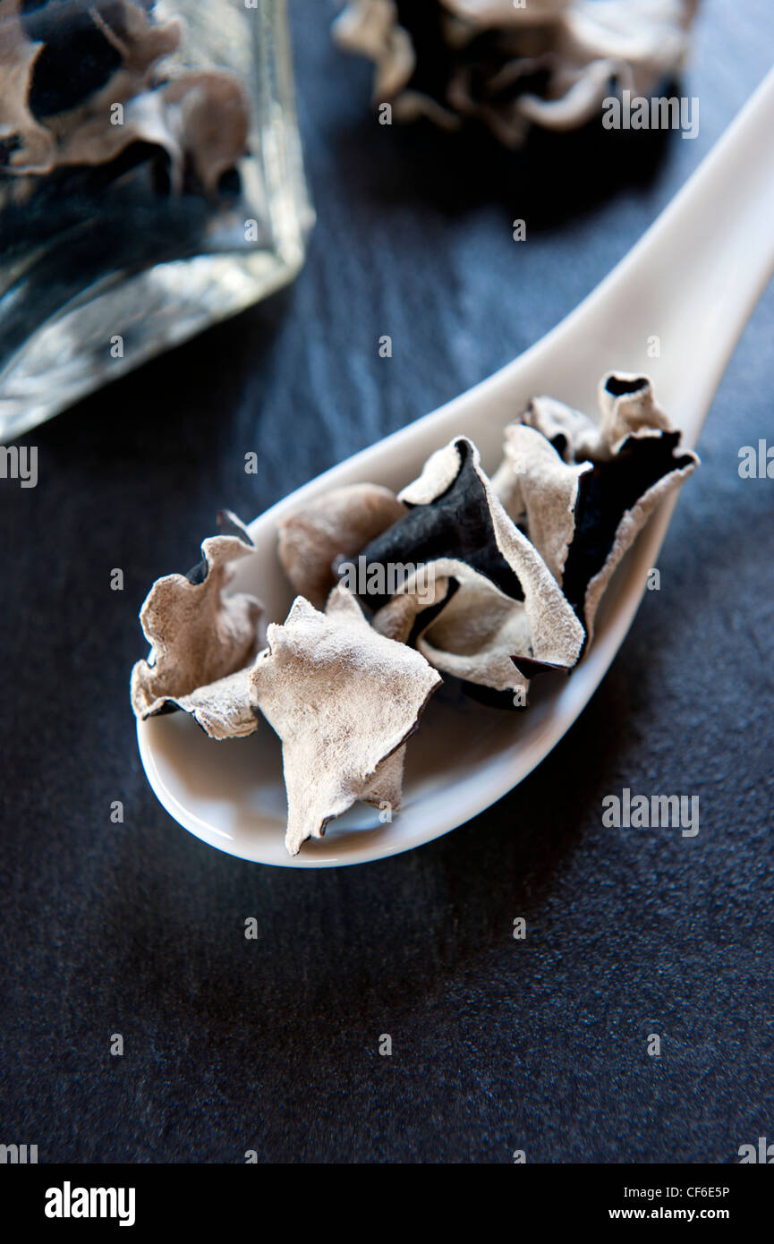 A Spoonful of Dried Chinese Black Mushrooms, set up on a Slate Work Surface Stock Photo Alamy