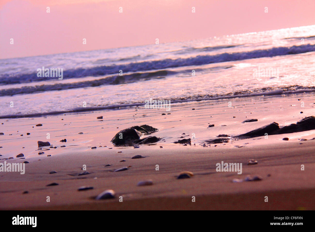 Sunrise over the beach Stock Photo - Alamy
