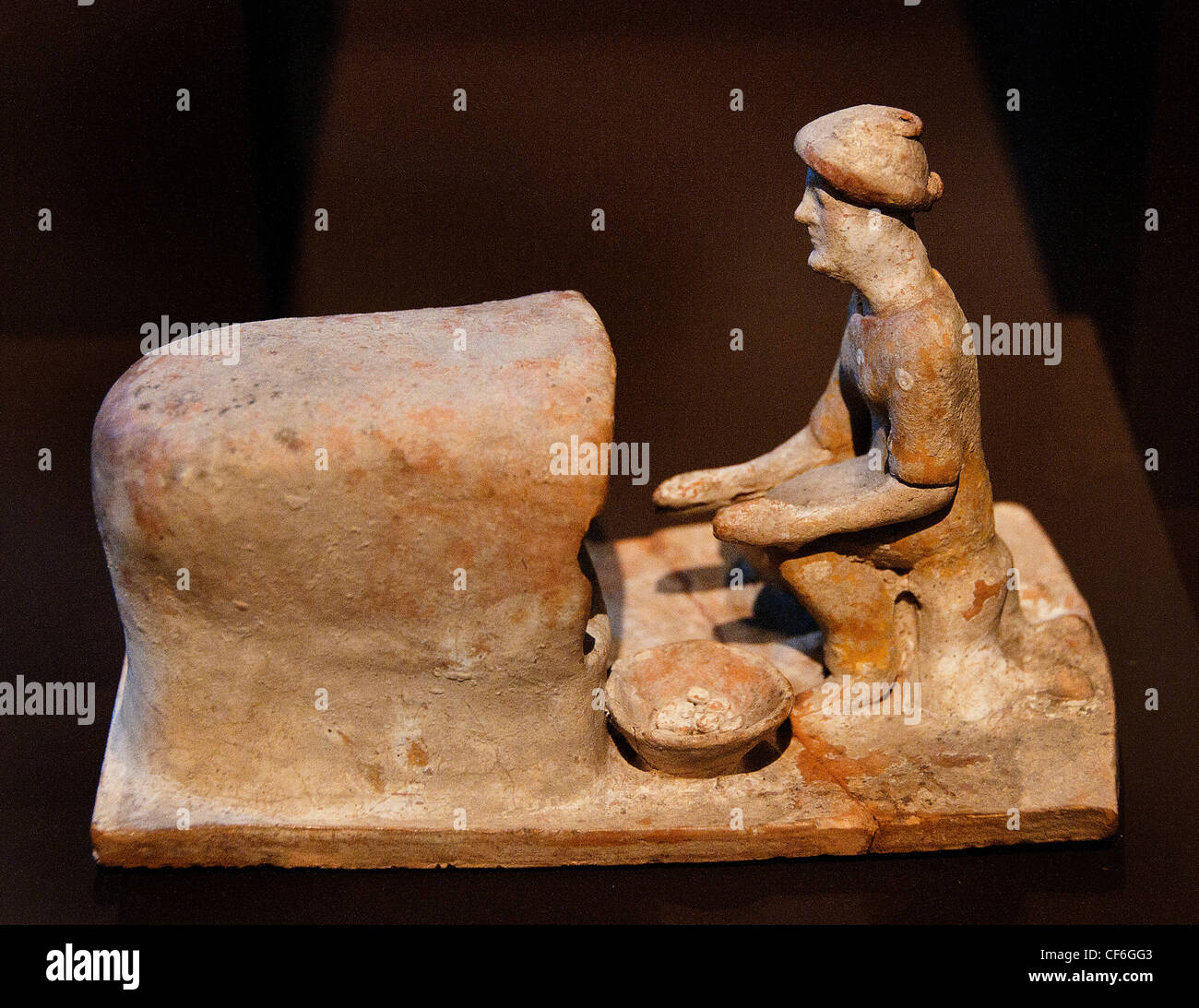 Cook in oven 5 century BC  Tanagra  ancient Greek terracotta figurine Boeotian town of Tanagra Greece Stock Photo