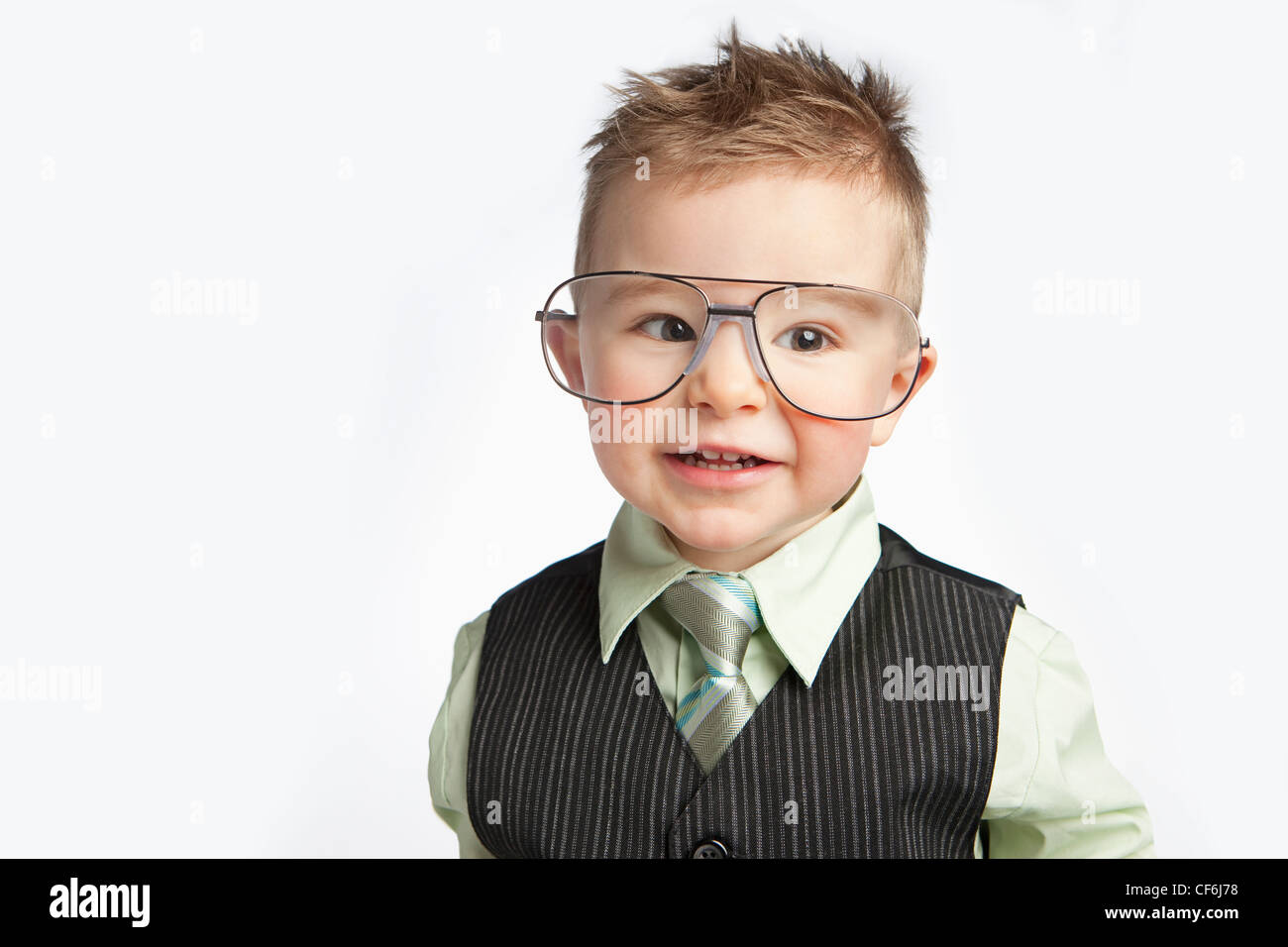 A Young Boy Dressed In A Suit And Necktie Wearing Very Large Eyeglasses