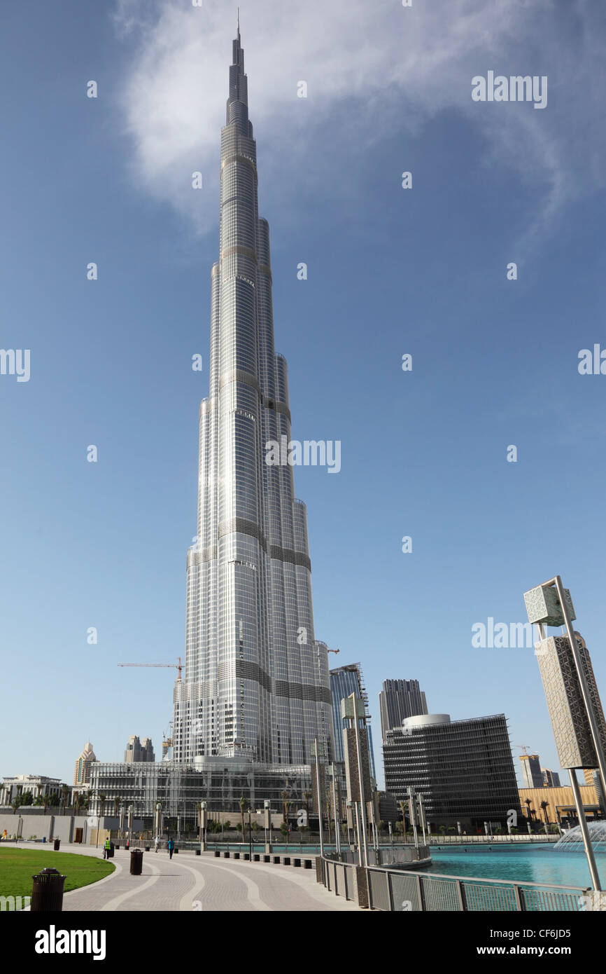 DUBAI - APRIL 17: Burj Dubai skyscraper, pedestrian road near water, sunny day, 17 april 2010 in Dubai, UAE Stock Photo