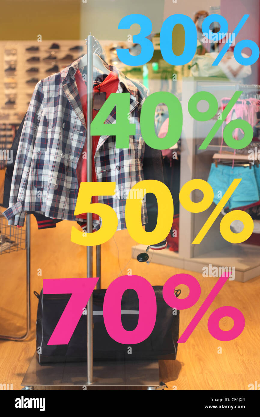 sale in casual clothes store, sticker with number of percents on window Stock Photo