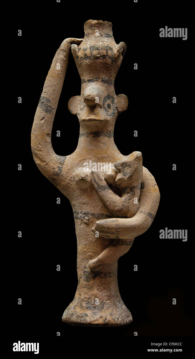 woman carrying a vase and nursing children Child Cypro geometric III 9 - 8 cent BC Cyprus Cypriot Stock Photo