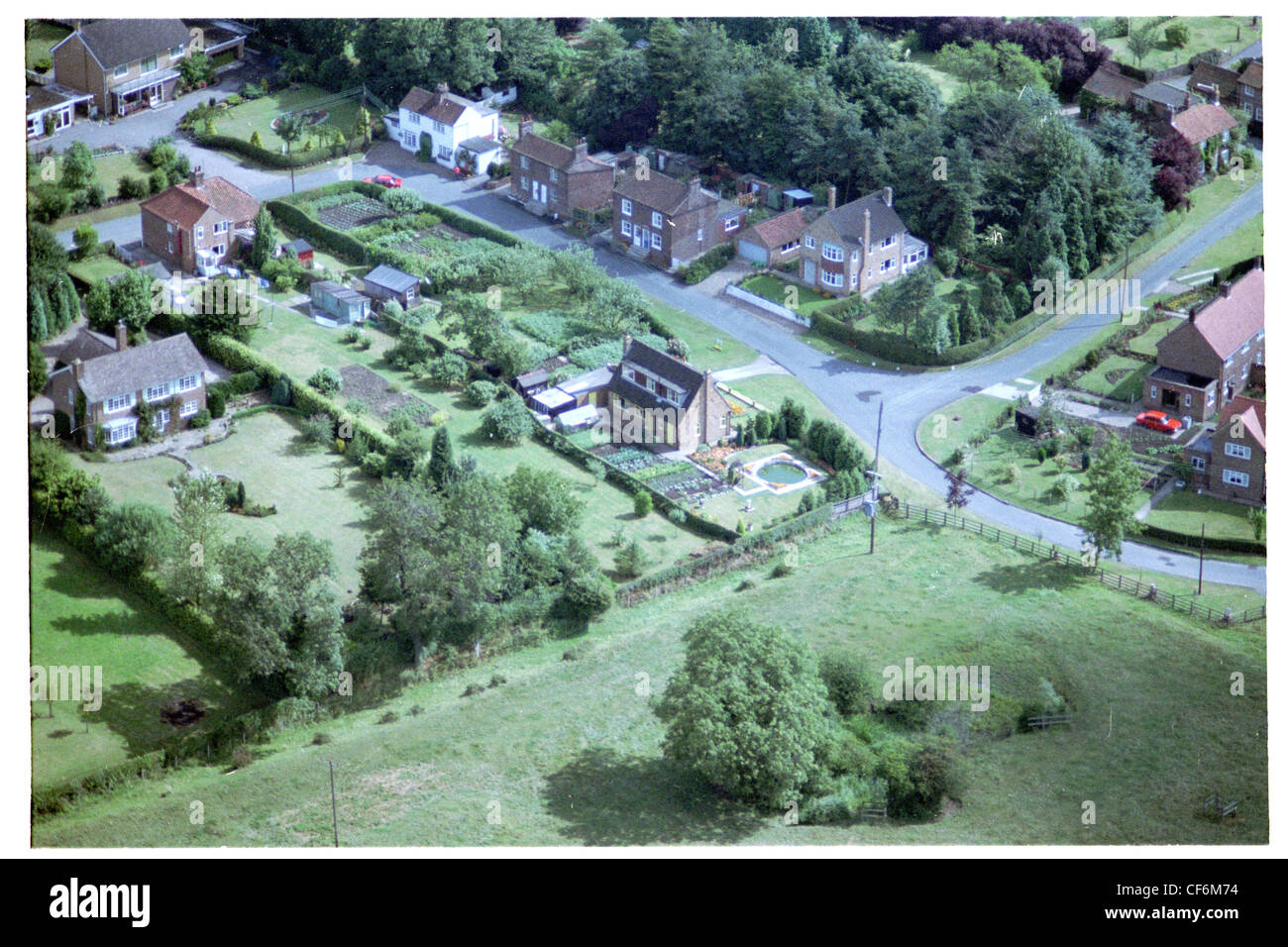 Oblique aerial photograph of the centre of the village of Kilnwick in east Yorkshire taken late summer Stock Photo