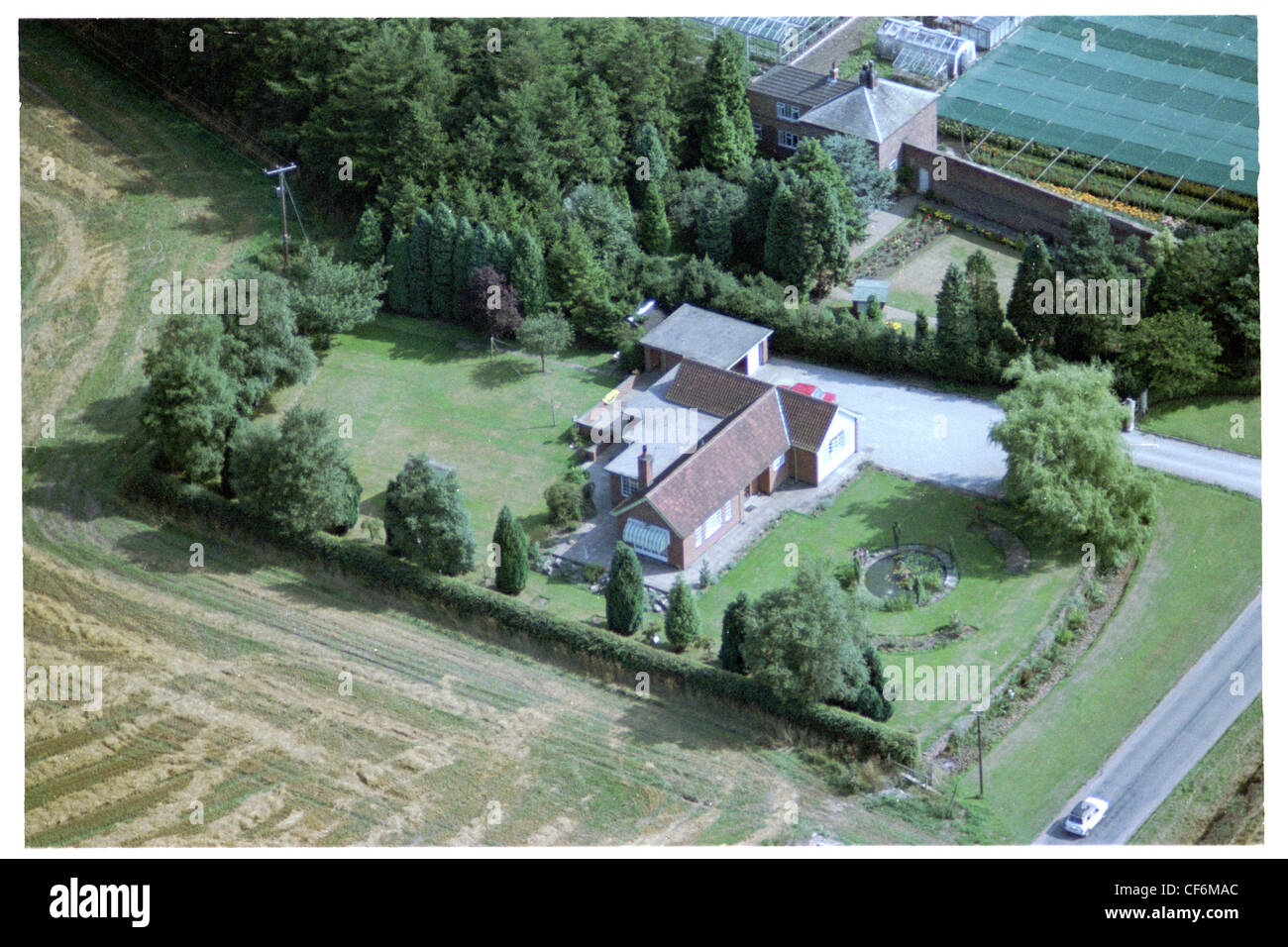 Oblique aerial photograph of a house in the village of Kilnwick, east Yorkshire Stock Photo