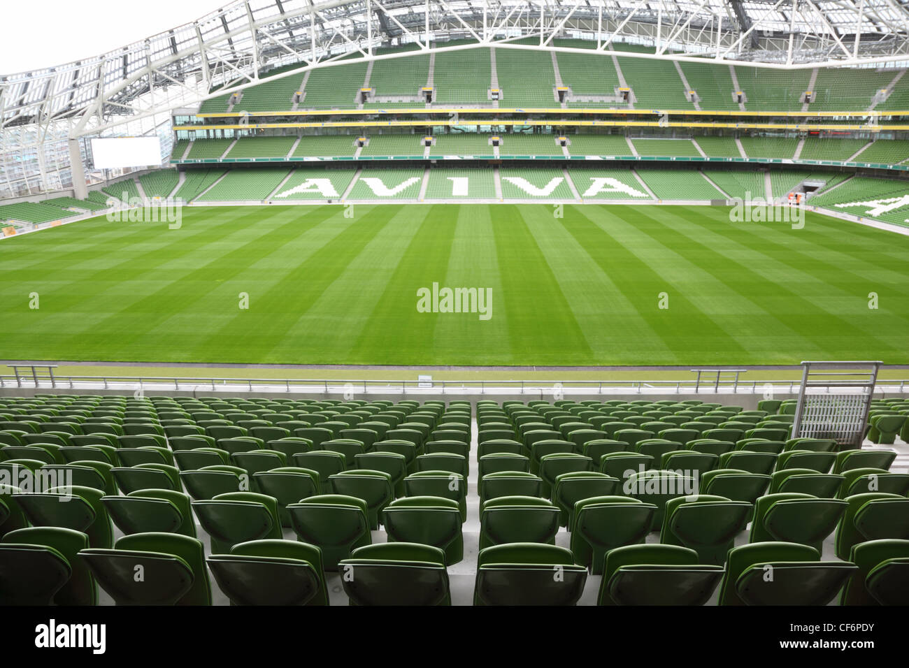 DUBLIN - JUNE 10: Rows of green seats in an empty stadium Aviva June 10, 2010 in Dublin. Stadium Aviva after repair Stock Photo