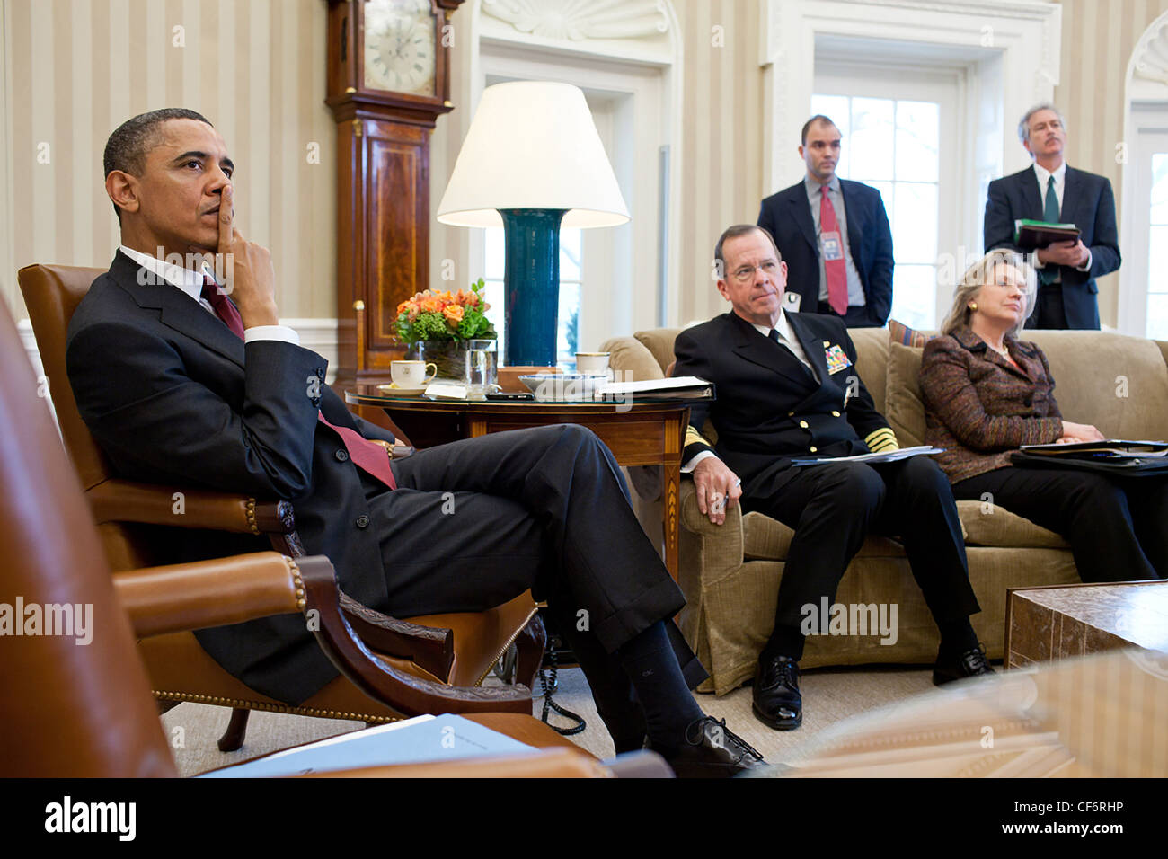President Barack Obama is briefed in the Oval Office before meeting ...