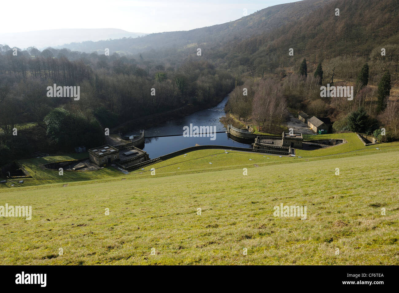 looking down the grassed dam wall at ladybower derbyshire england uk Stock Photo