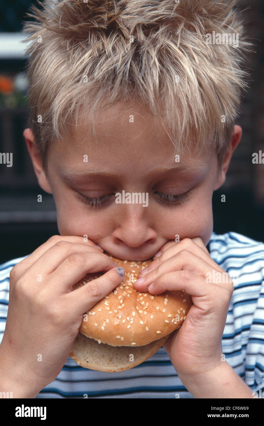 Male Child Blonde Spiky Hair Wearing Blue And White Striped T