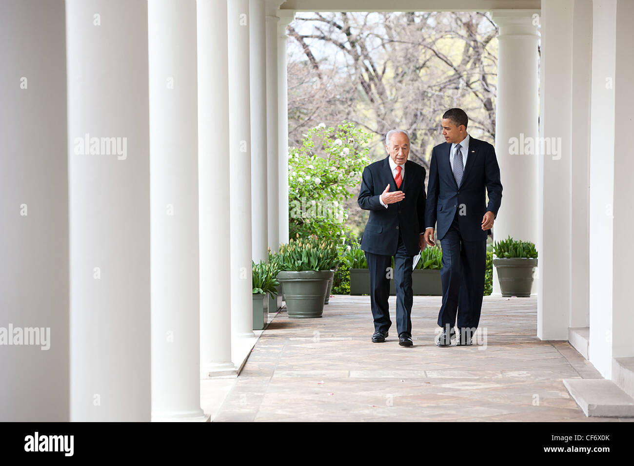 President Barack Obama and President Shimon Peres of Israel walk along the Colonnade of the White House following their meeting April 5, 2011 in Washington, DC. Stock Photo