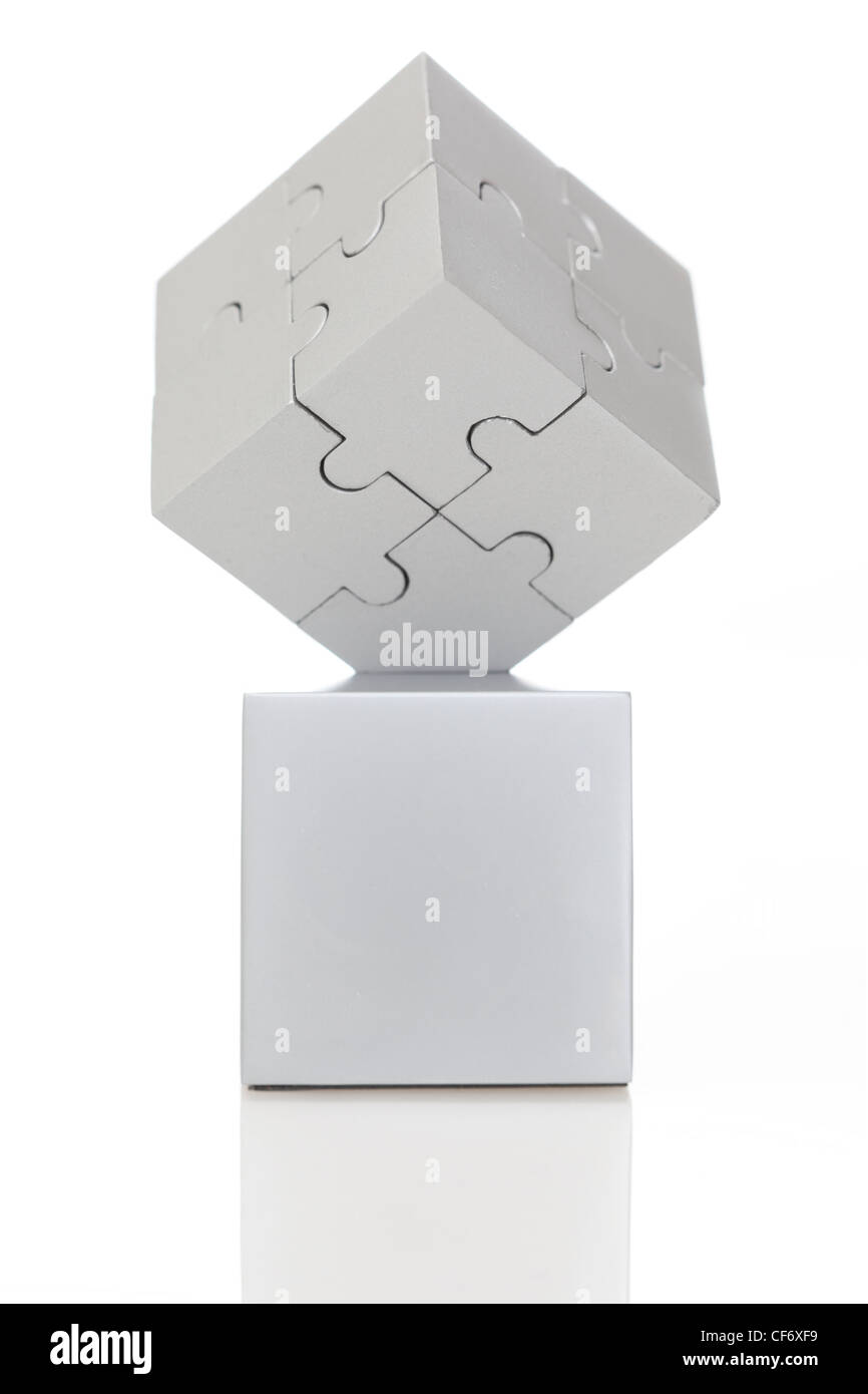 Gray cube of puzzles on white background Stock Photo