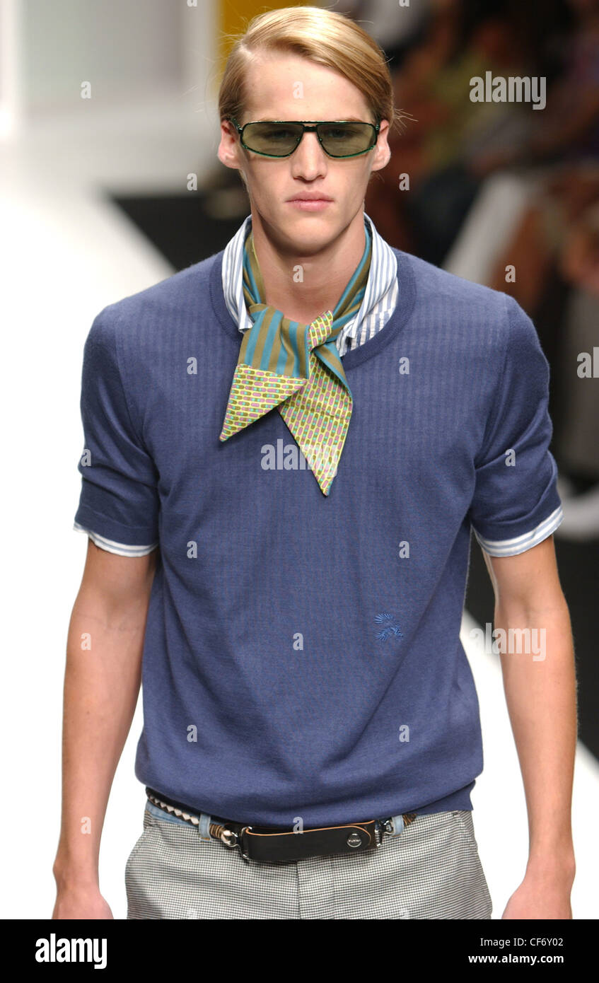 Byblos Milan Menswear S S Smart casual fashion: blue see through t shirt  White runway Blurred background Stock Photo - Alamy