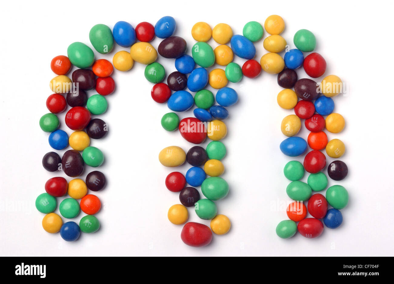 Different coloured M&Ms arranged in the shape of an M Stock Photo Alamy