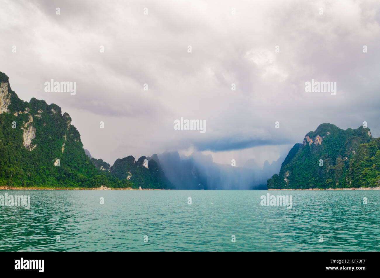 Inclement weather in Khao Sok National Park, Thailand. An approaching rainstorm is clearly visible in the distance. Stock Photo