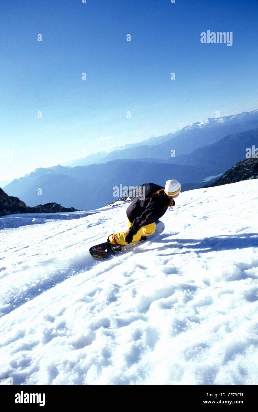 PM09576 Female snowboarding down a mountain Stock Photo Alamy