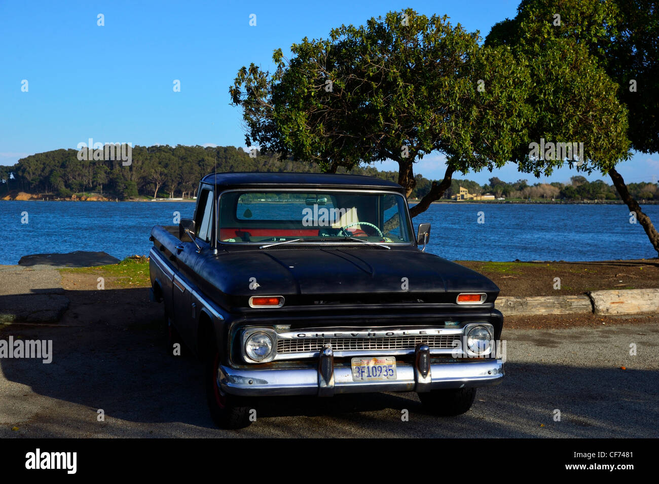 A 1964 vintage Chevy parked in front of Coyote Point State Park, Burlingame CA Stock Photo