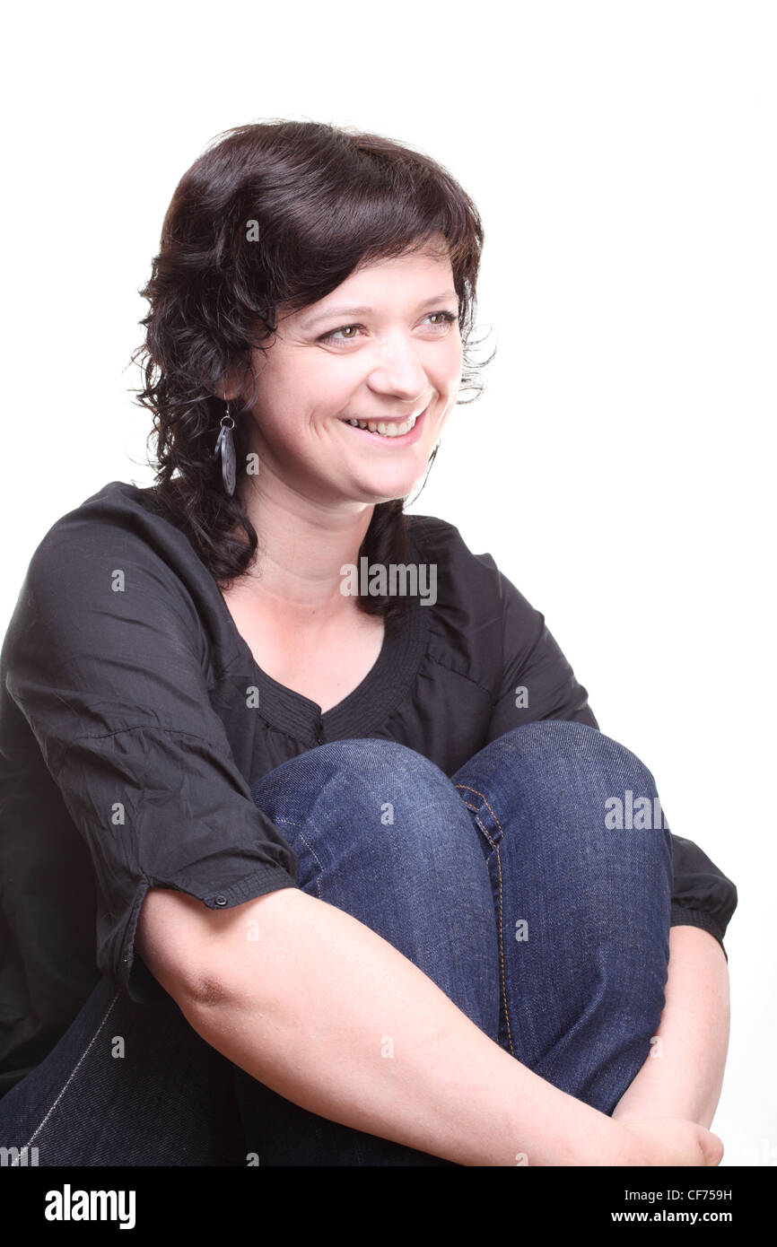One smiling young woman isolated on white background Stock Photo - Alamy