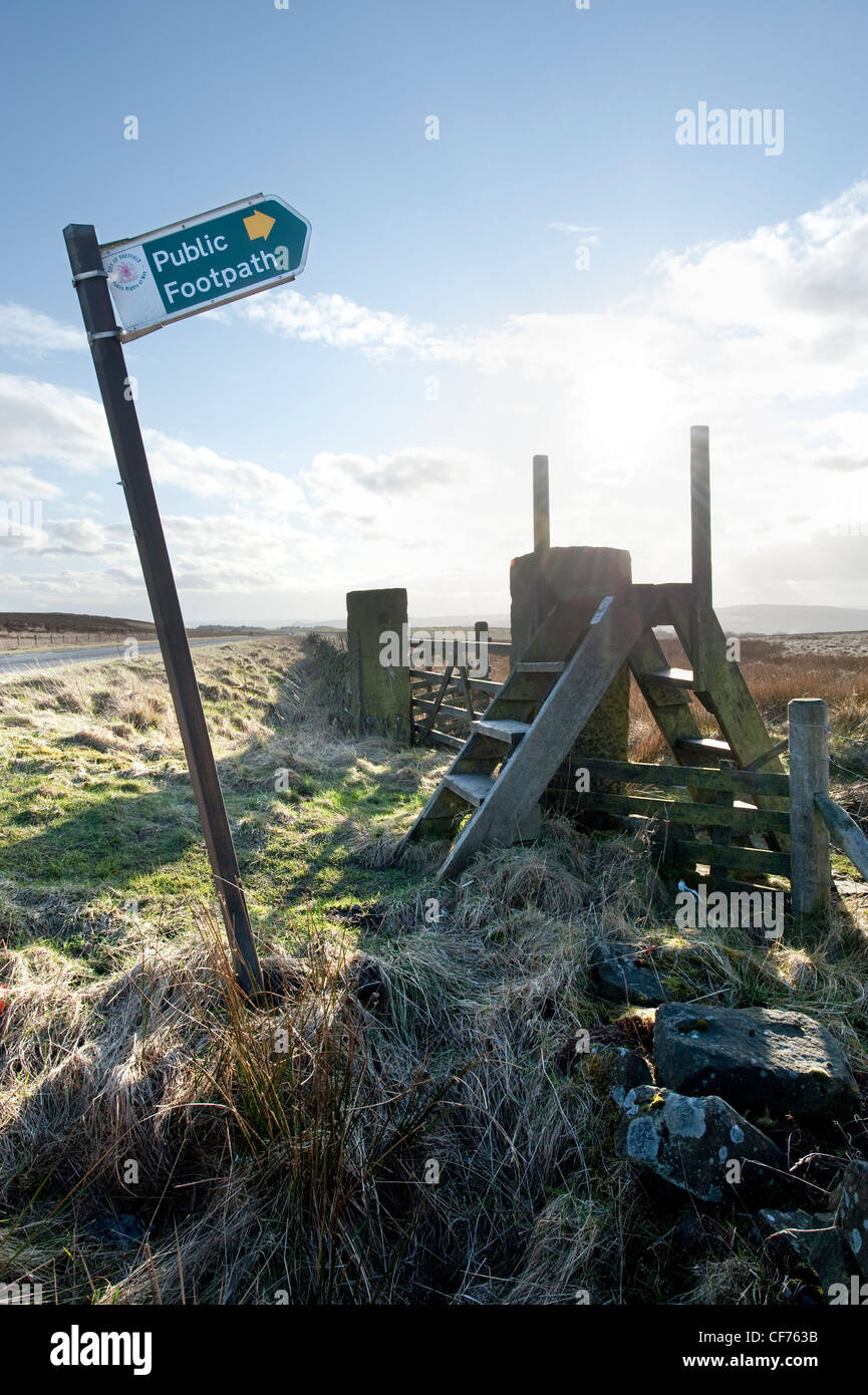 Public footpath signpost with pointing upwards with ladder style fence crossing, Peak District, Derbyshire, Great Britain Stock Photo
