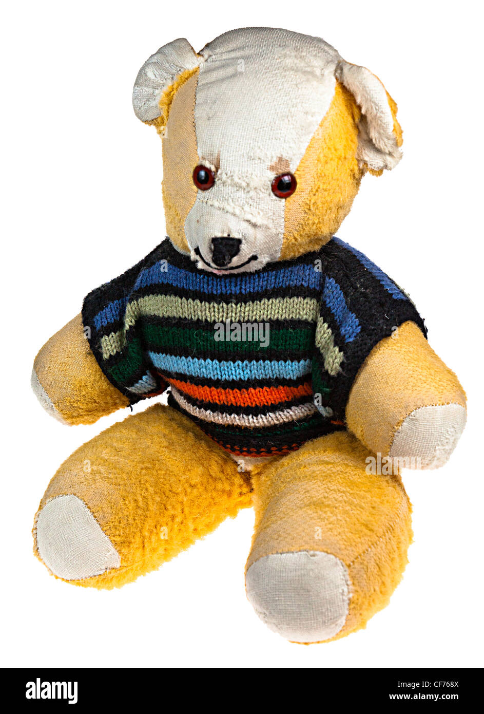 Teddy bear with striped woollen jumper, UK Stock Photo