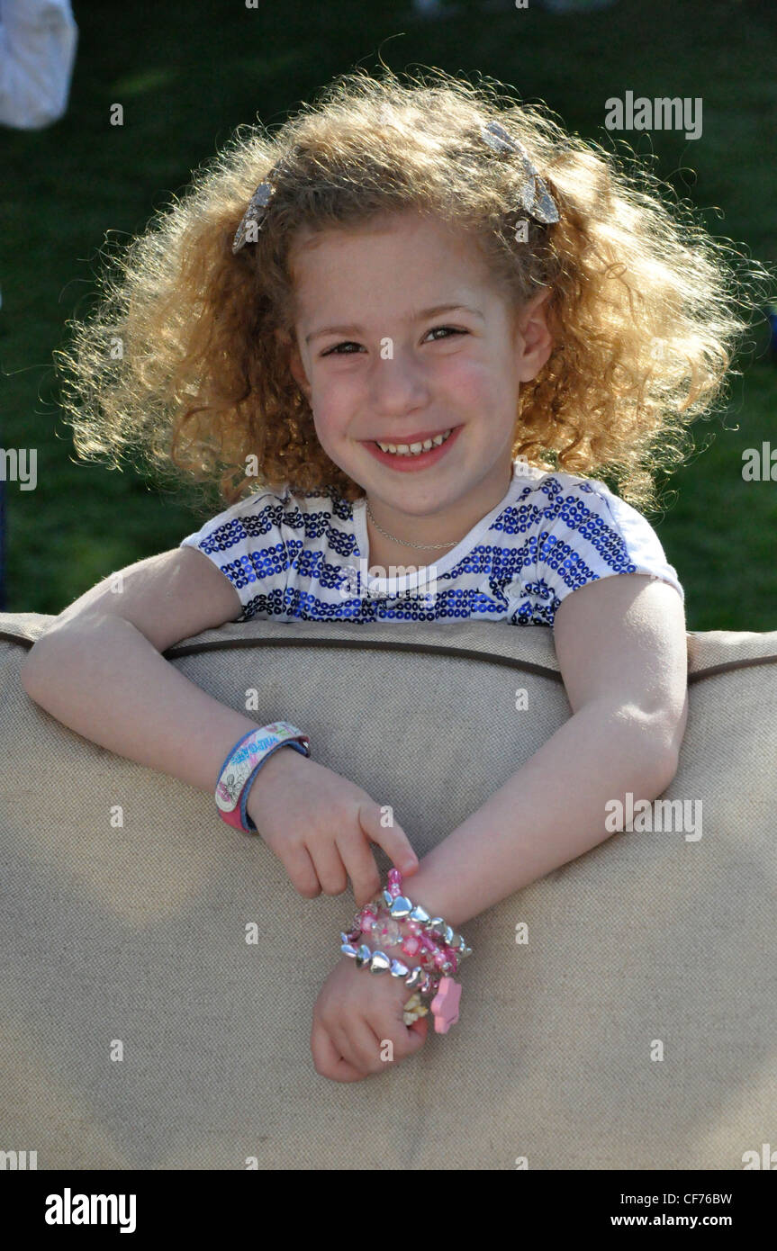 Happy little girl in sunshine with bangles Stock Photo Alamy