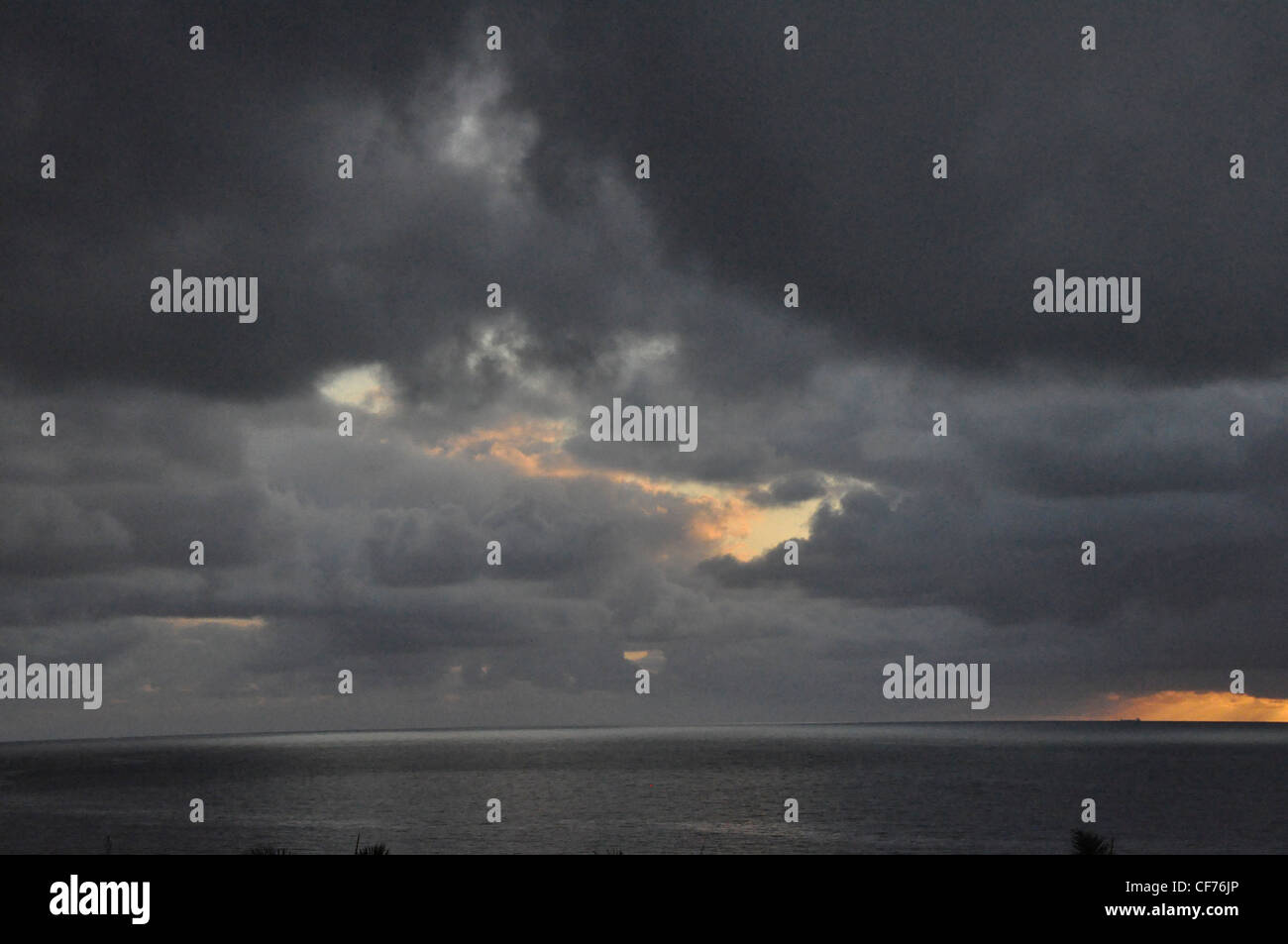 Late evening drama seascape black clouds sub tropical Stock Photo