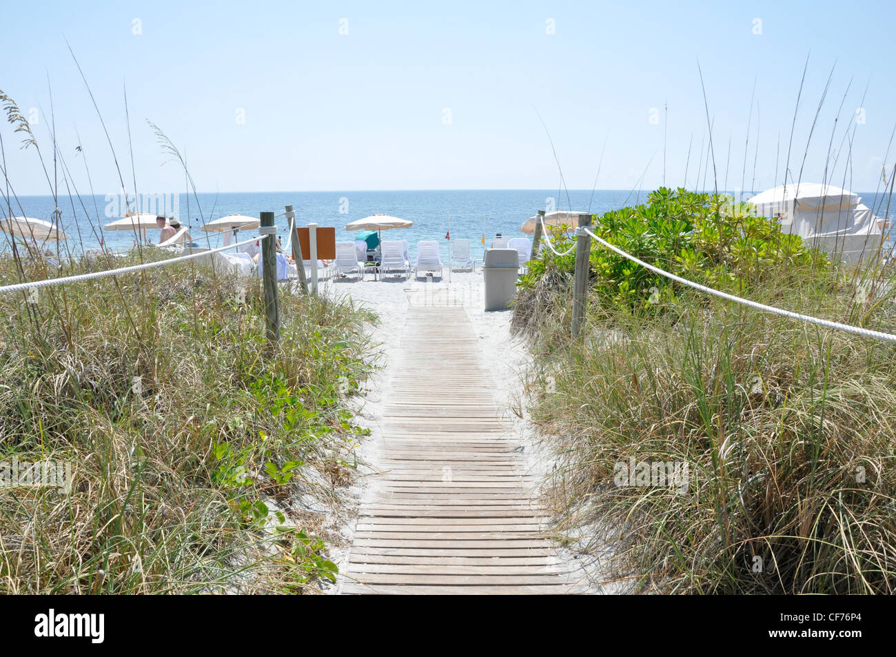 Beach walk summer sunshine luxury vacation Stock Photo
