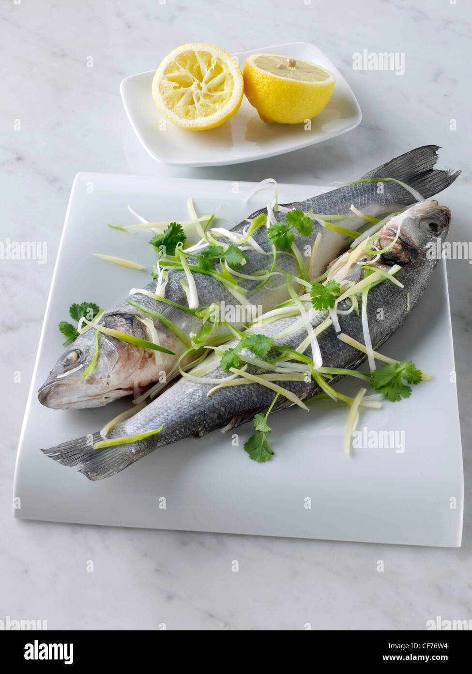 Sea bass cooked in foil with ginger and spring onions Stock Photo Alamy