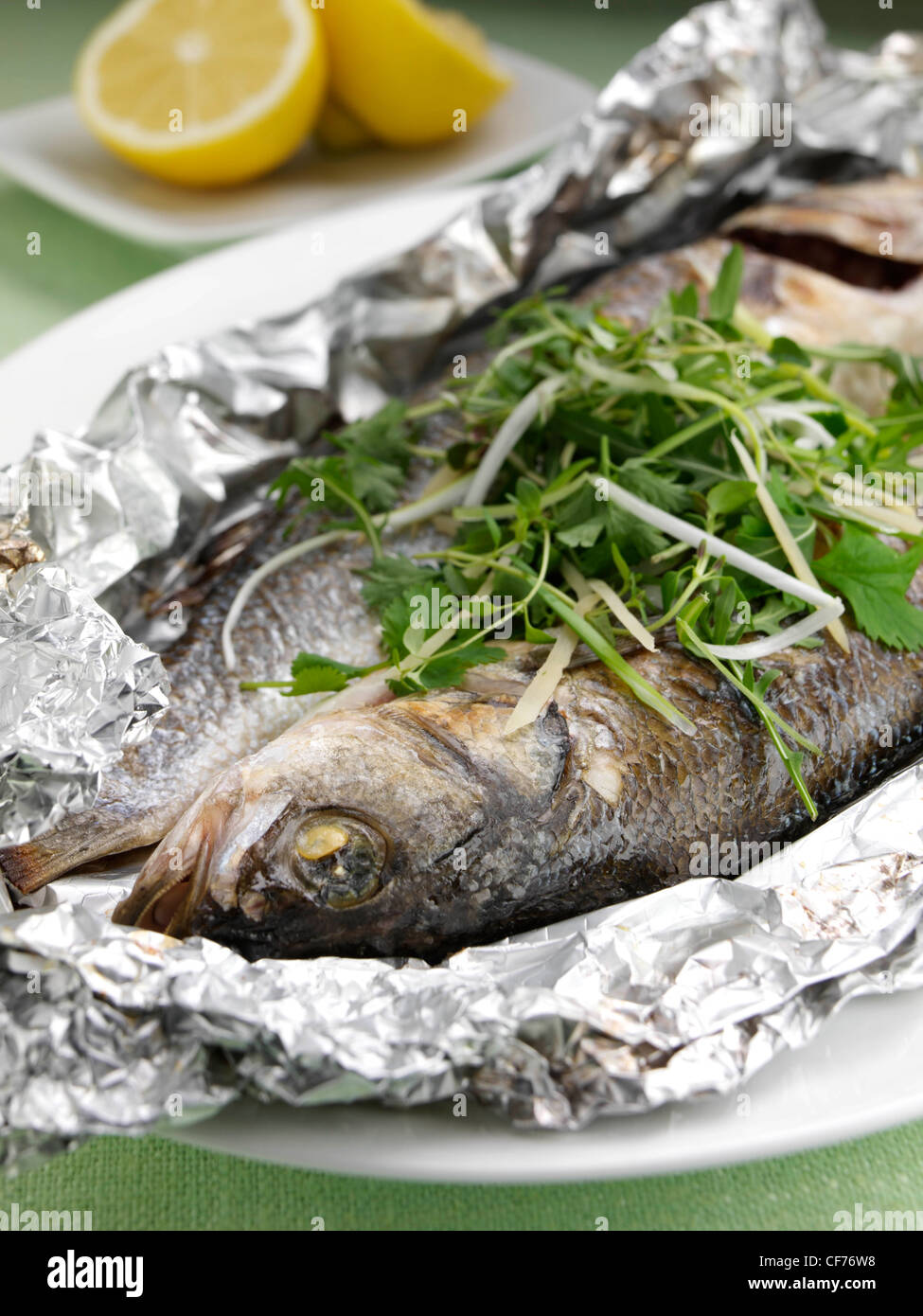 Diced ginger foil baked sea bass diced scallions ginger hi-res stock ...