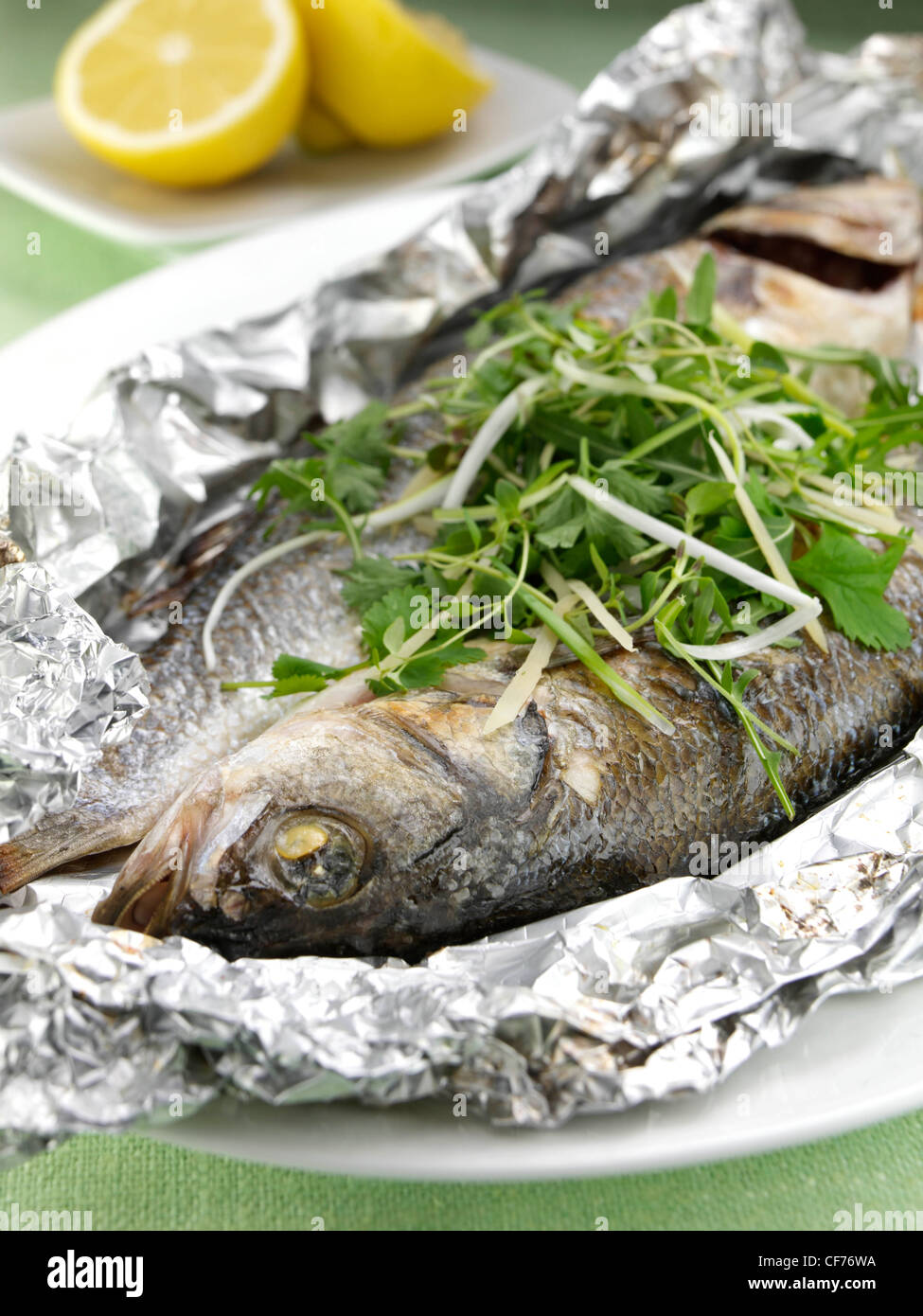 Sea bass cooked in foil with ginger and spring onions Stock Photo Alamy