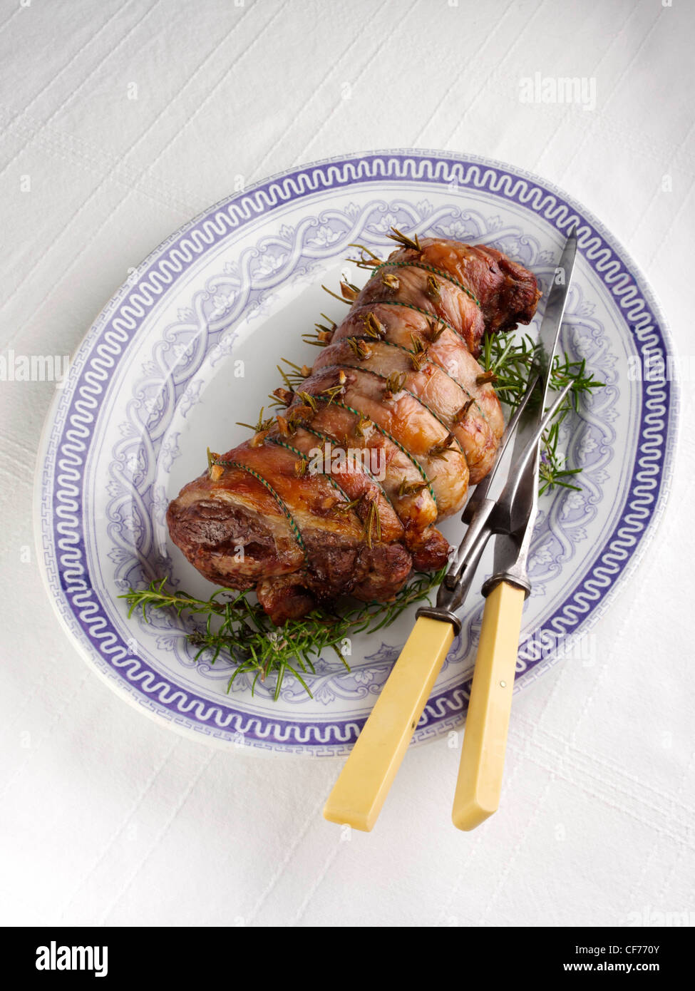Whole roasted boned rolled leg of lamb Stock Photo - Alamy