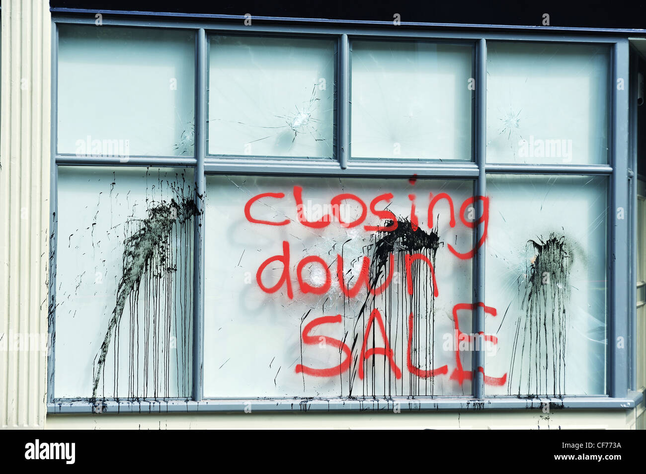Closing Down Sale Graffiti on Damaged Tesco Express Shop Window