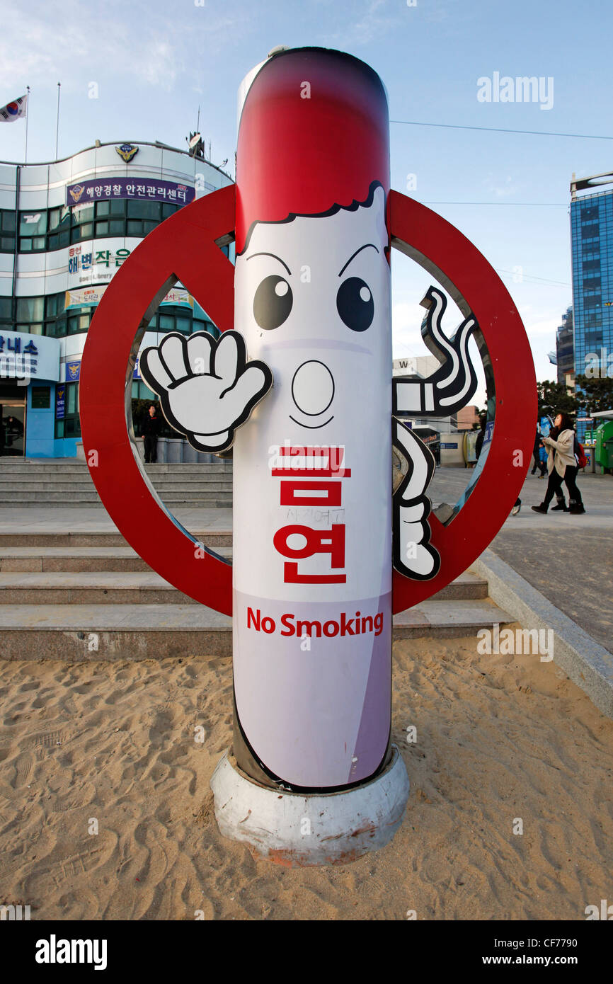 Funny no smoking sign on Haeundae Beach in Busan, South Korea Stock Photo