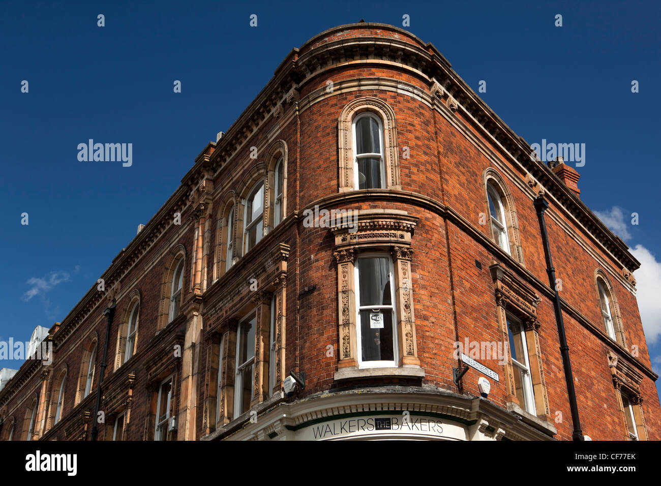 UK, Gloucestershire, Stroud, Kendrick Street, upper floors of Walkers Bakery shop in unusual street corner building Stock Photo