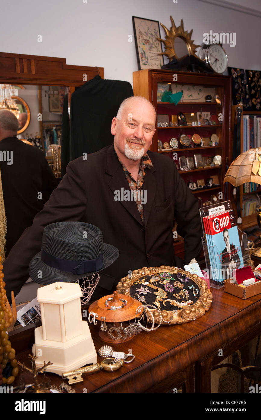 UK, Gloucestershire, Stroud, High Street, Dave Ireland, owner of Time after Time vintage clothing shop Stock Photo