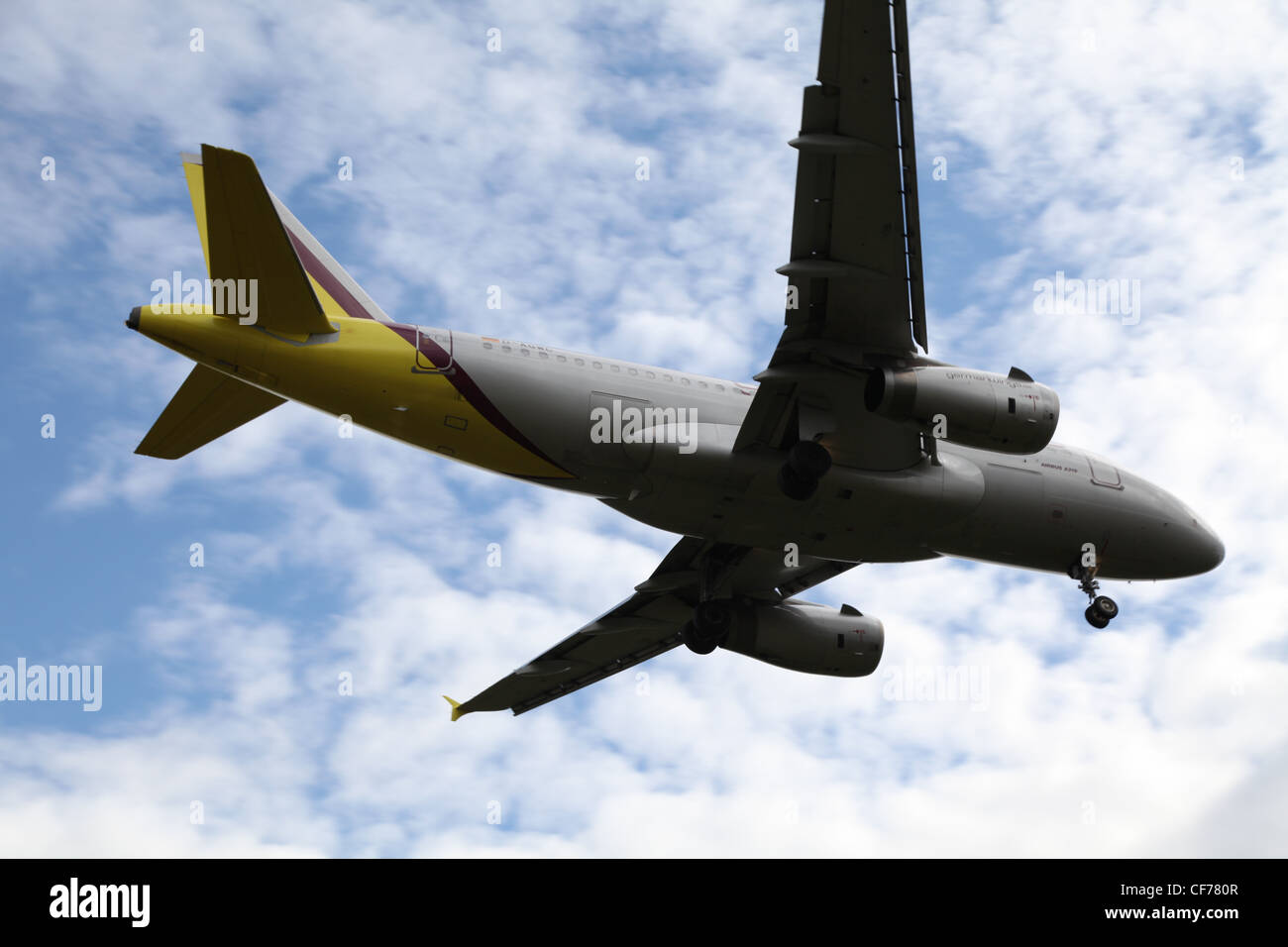 Plane in a cloudy sky, Flugzeug am bewölkten Himmel Stock Photo