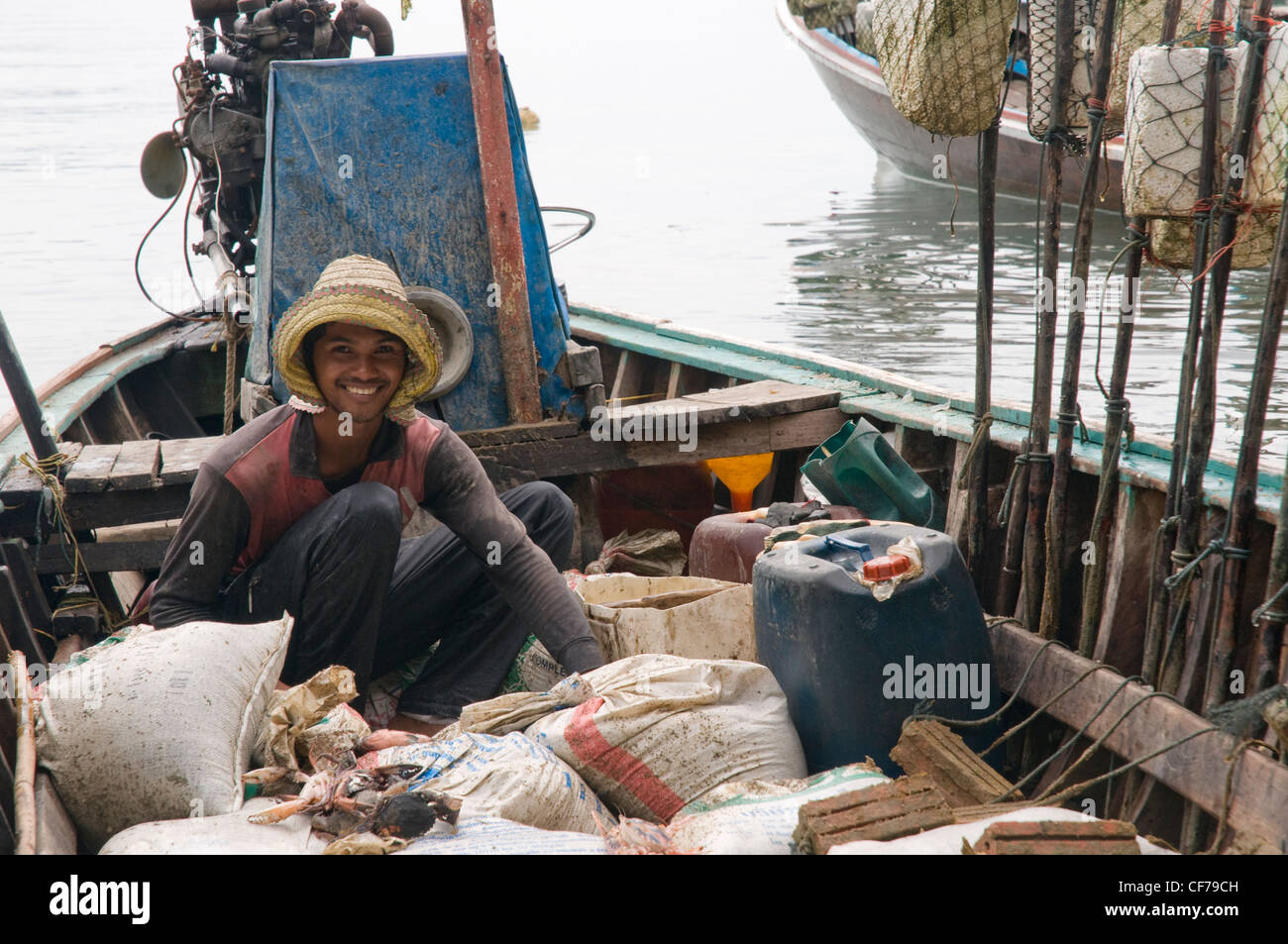 Fisherman sitting on boat hi-res stock photography and images - Alamy