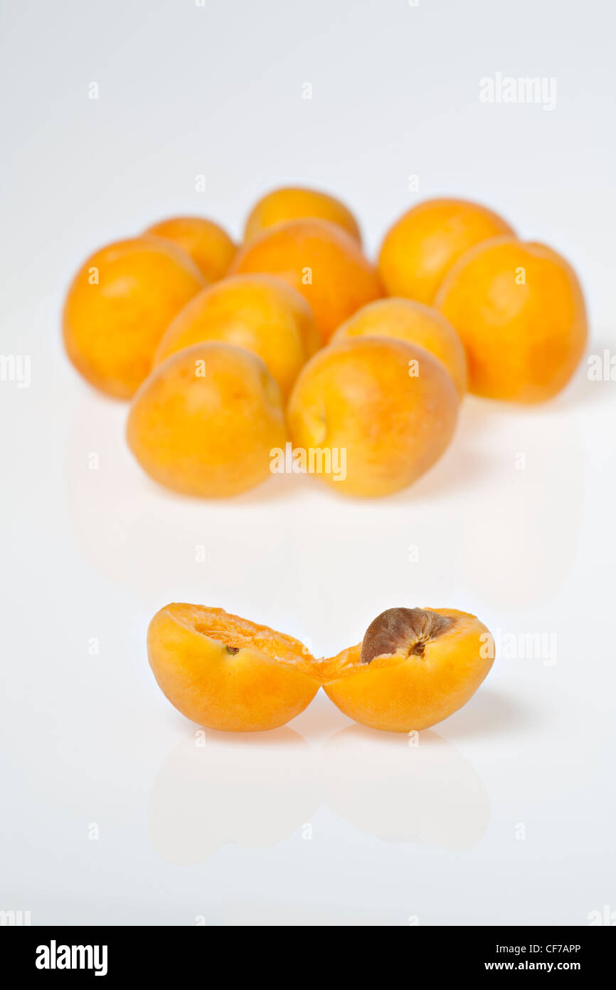 Fresh apricots, one cut in half Stock Photo