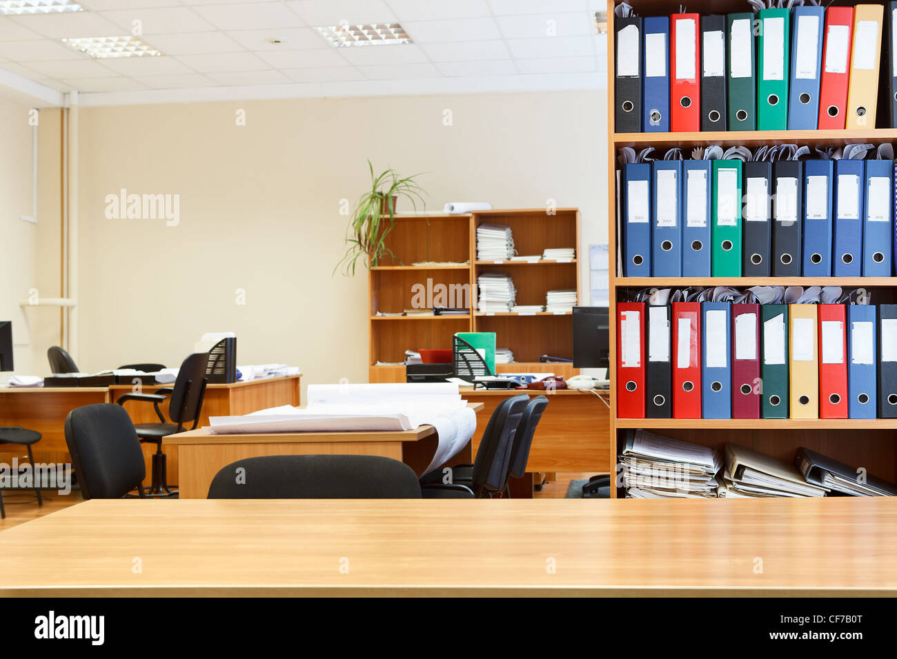 Modern Russian office interior with tables, chairs and bookcases ...