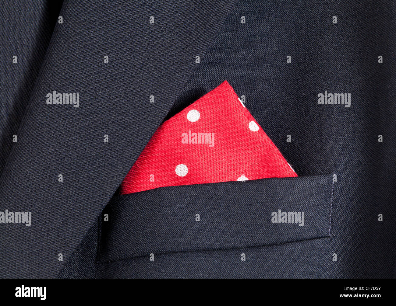 Folder linen handkerchiefs in red with white spots in top pocket of blazer Stock Photo
