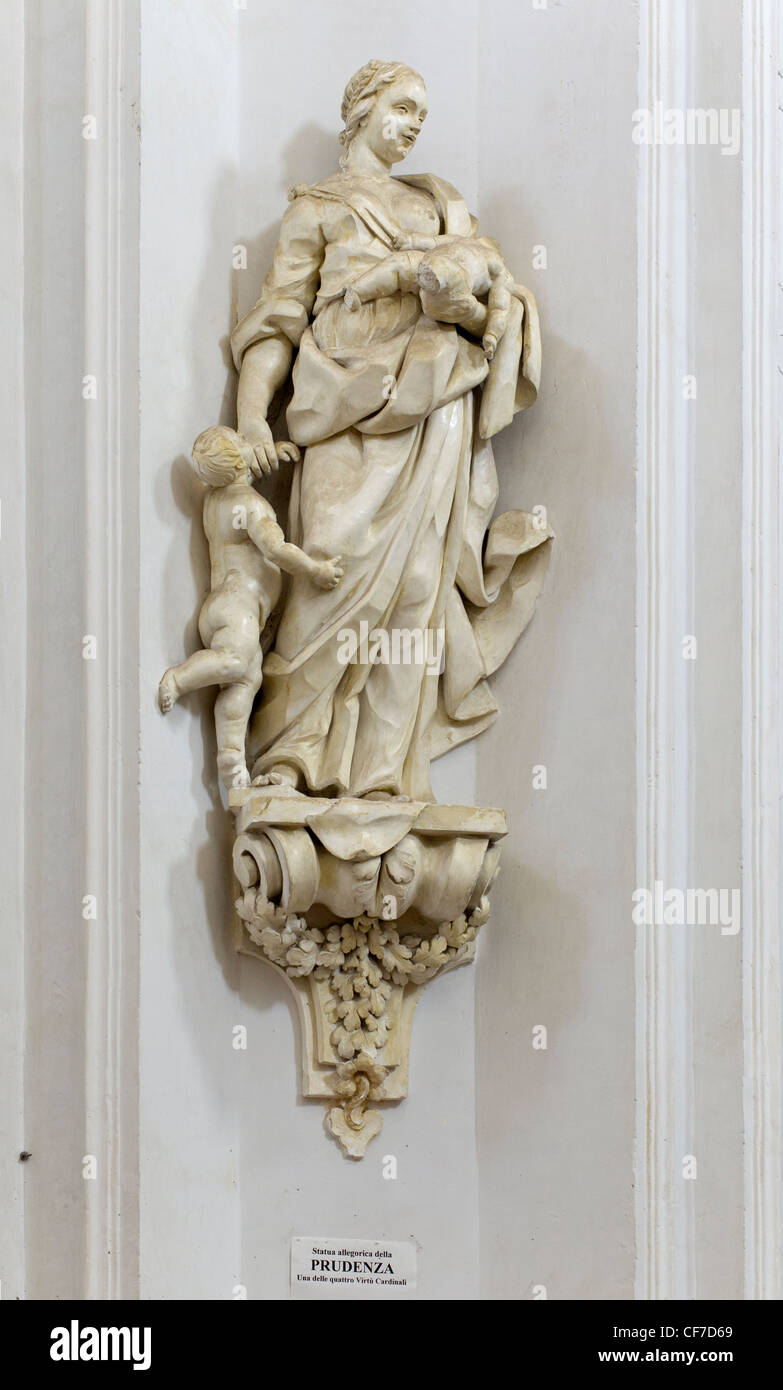 Interior of the Chiesa di San Carlo Borromeo al Corso in Noto: Statue to the four cardinal virtues (Prudence) Stock Photo