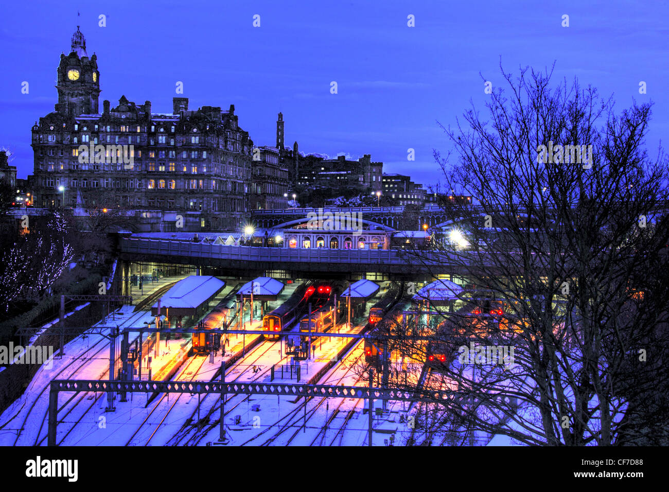 Waverley station at dusk in winter snow, Princes St, Edinburgh, Scotland, UK @HotpixUK Stock Photo