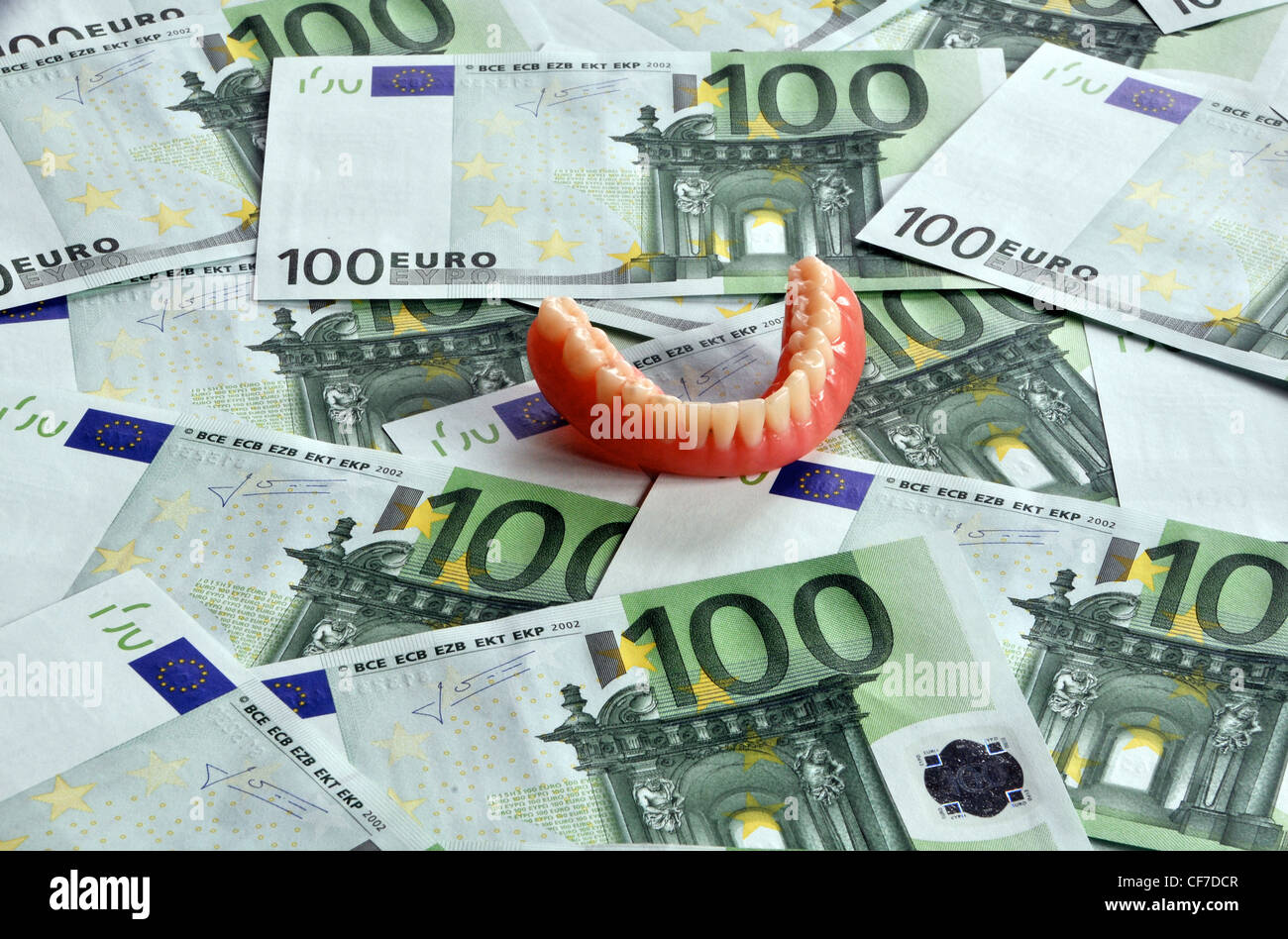 dental prosthesis on euro notes Stock Photo
